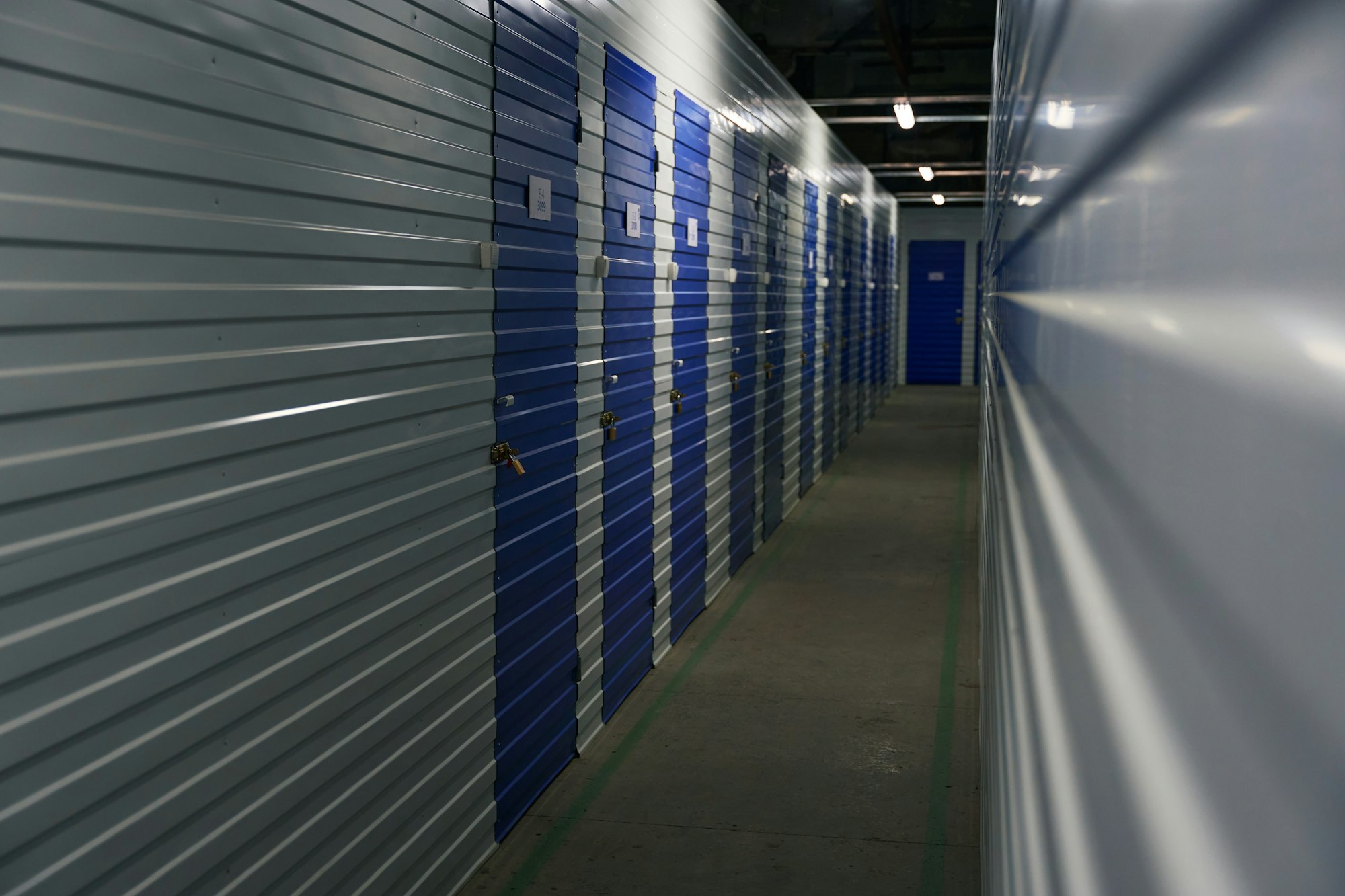 Warehouse storage indoors with self-storage unit, long corridor